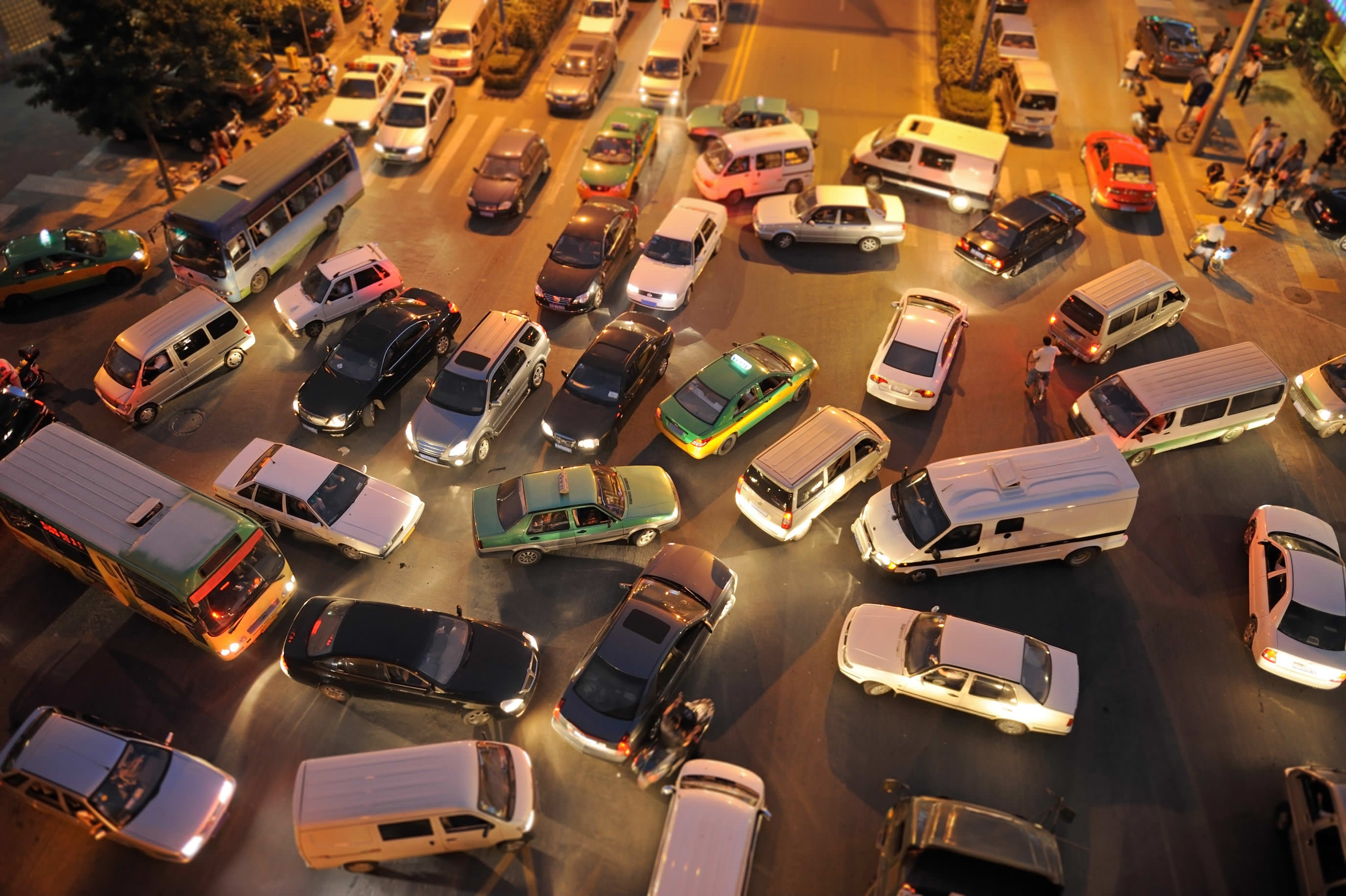 lots of cars on a busy street colliding