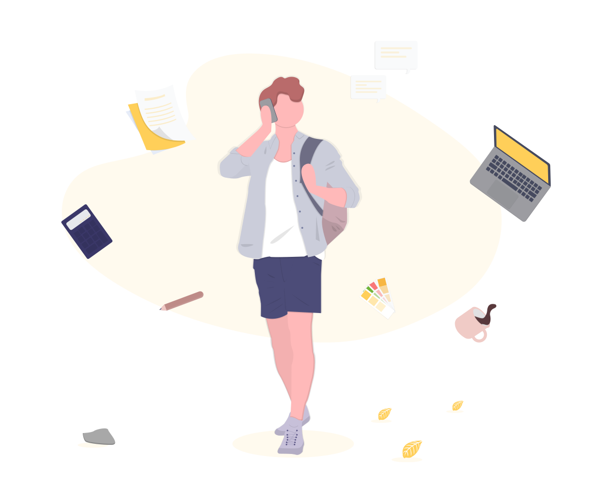 person on phone surrounded by laptop, coffee cup and documents